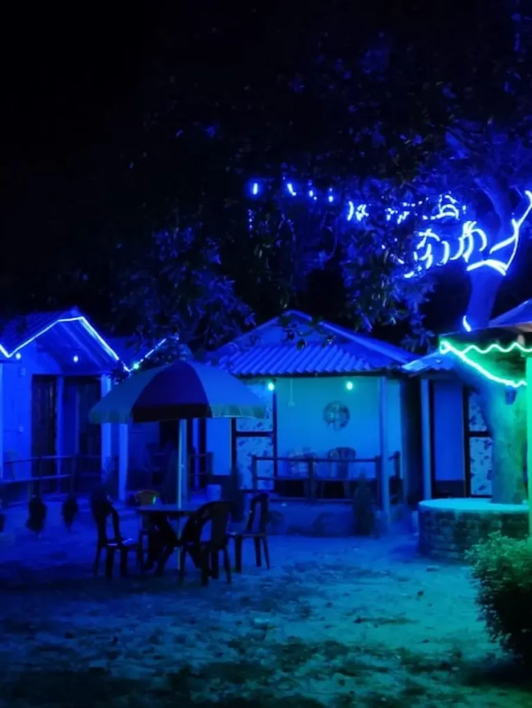 Rainbow Camp illuminated at night