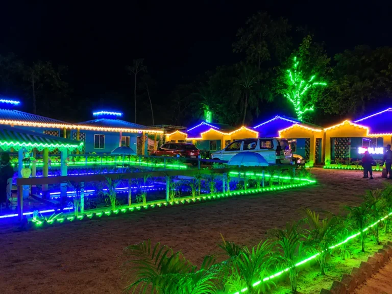 Blue Eyes Eco Resort illuminated cottages at night